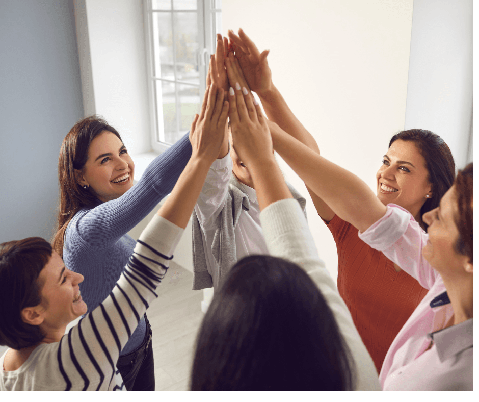 Women celebrating together - support and encouragement in therapy